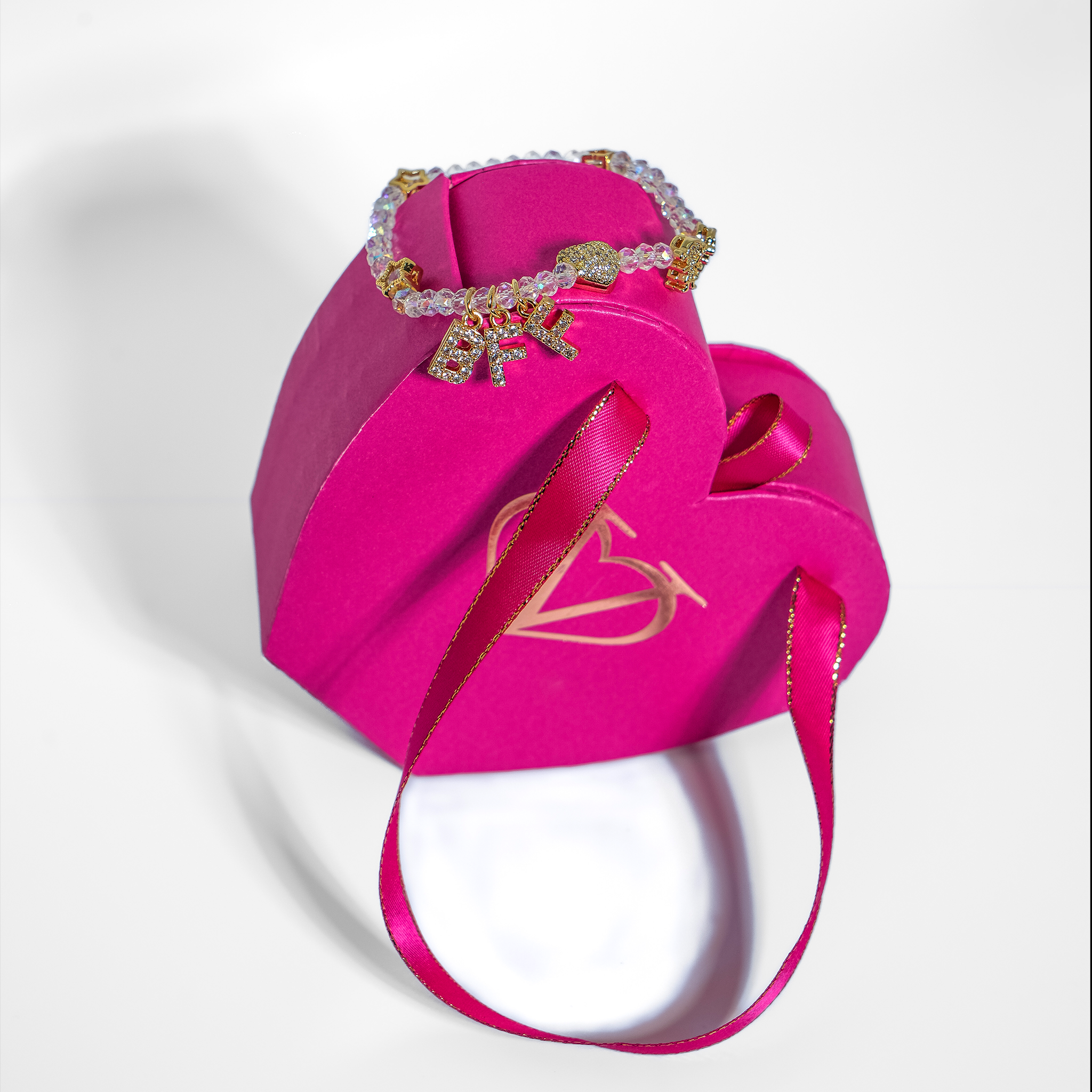 Bracelet with zirconium beads and gold-platted charms