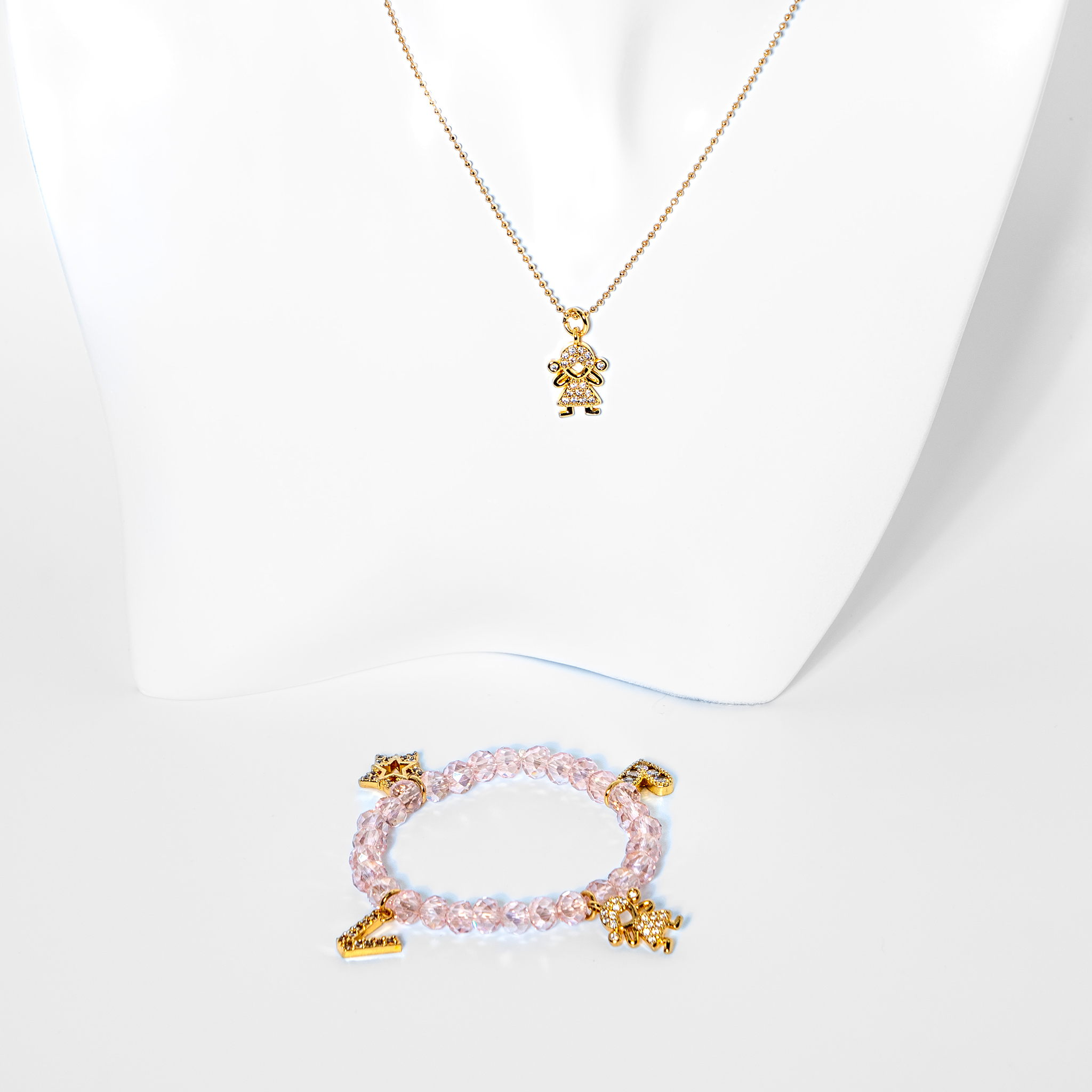 Zirconium bracelet with gold plated charms and necklace