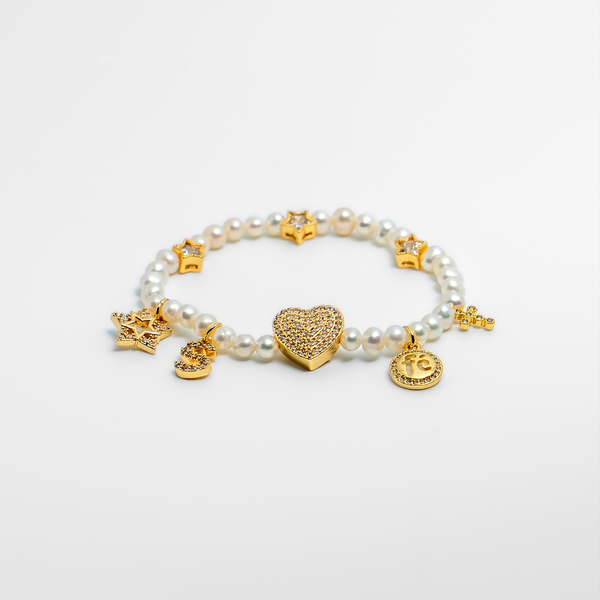 Bracelet with mini pearls and gold plated charms