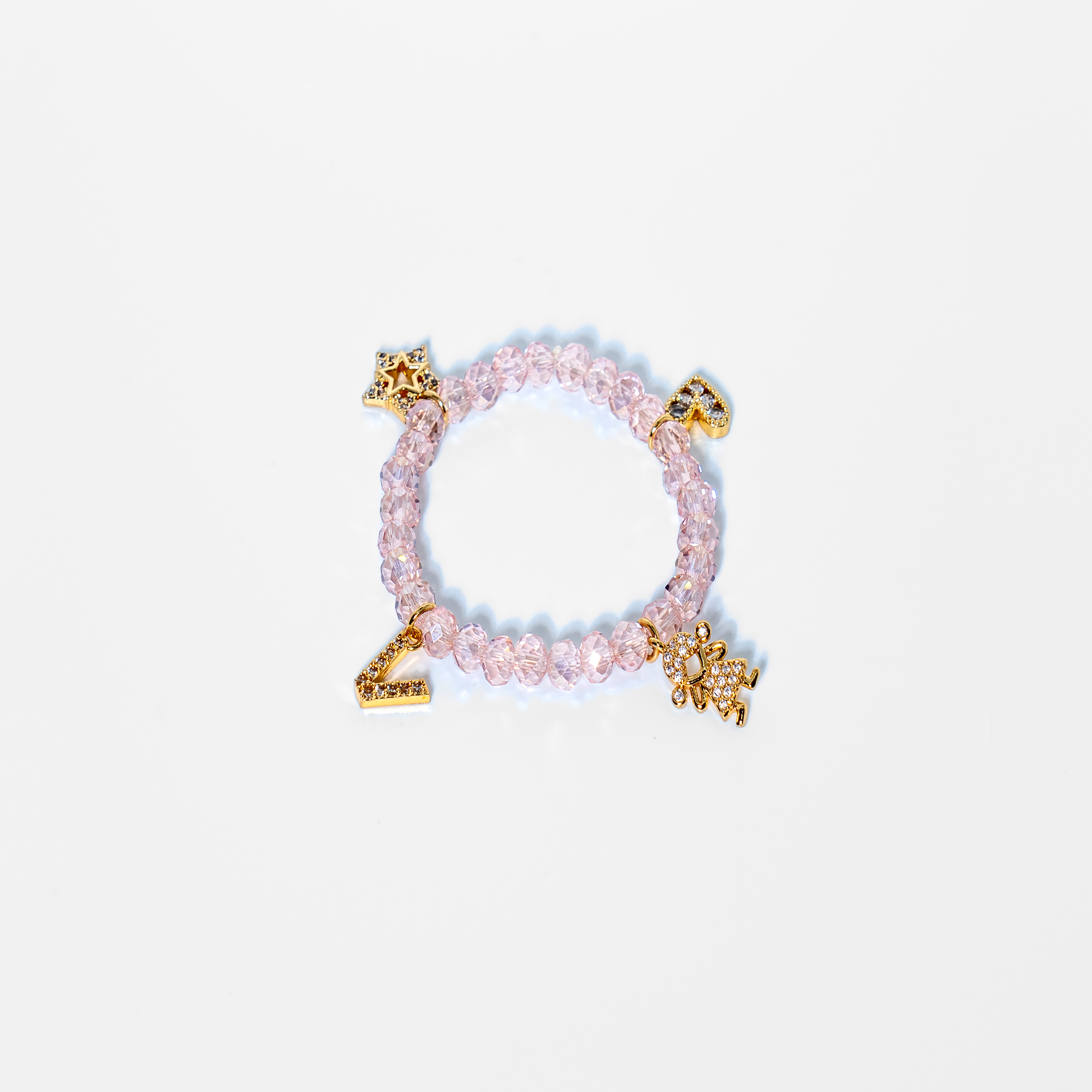 Bracelet made with zirconium beads and gold-plated charms